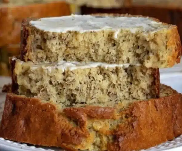 Delicious homemade banana bread loaf on a wooden table