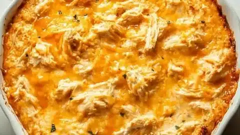 Delicious homemade Buffalo Chicken Dip served in a bowl with chips.