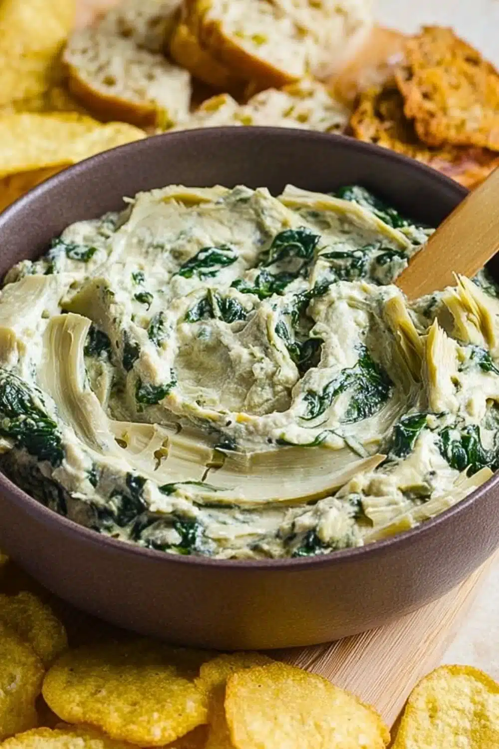 Creamy Spinach Artichoke Dip served with crispy tortilla chips