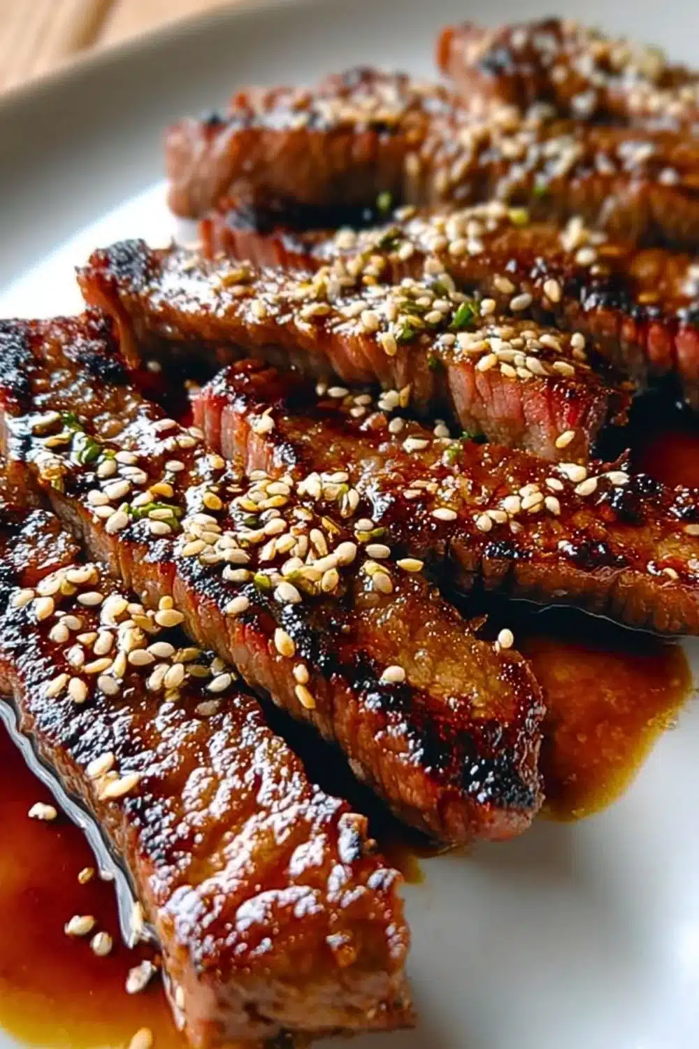 Teriyaki marinated beef strips garnished with sesame seeds