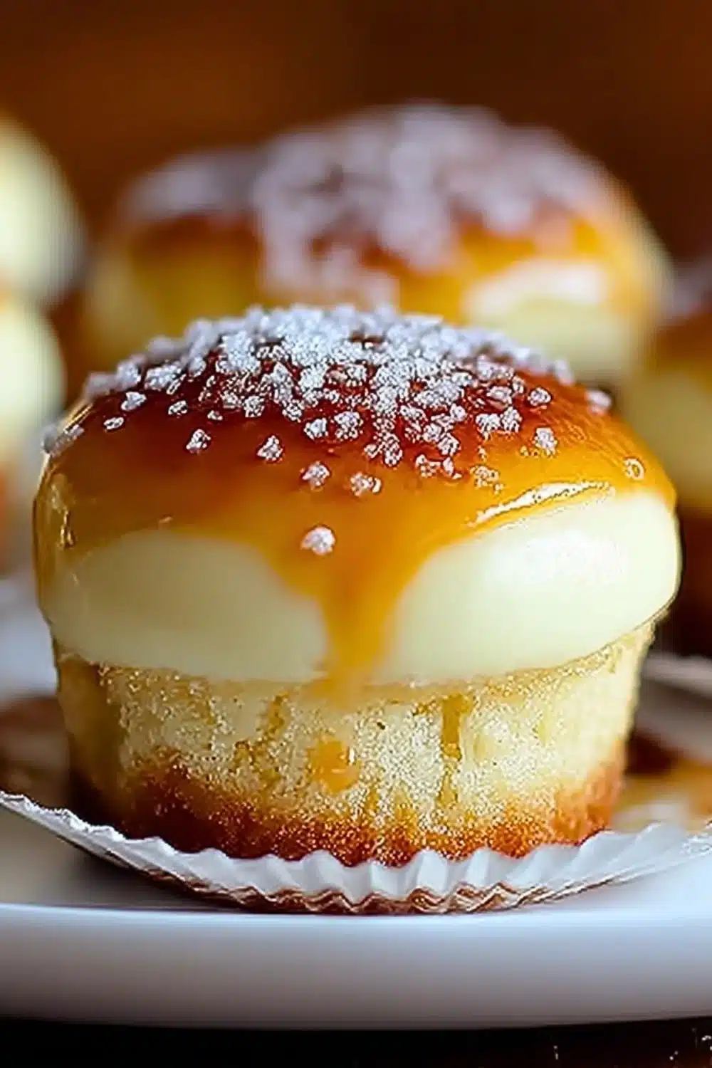 Vanilla bean crème brûlée cheesecake cupcakes topped with caramelized sugar
