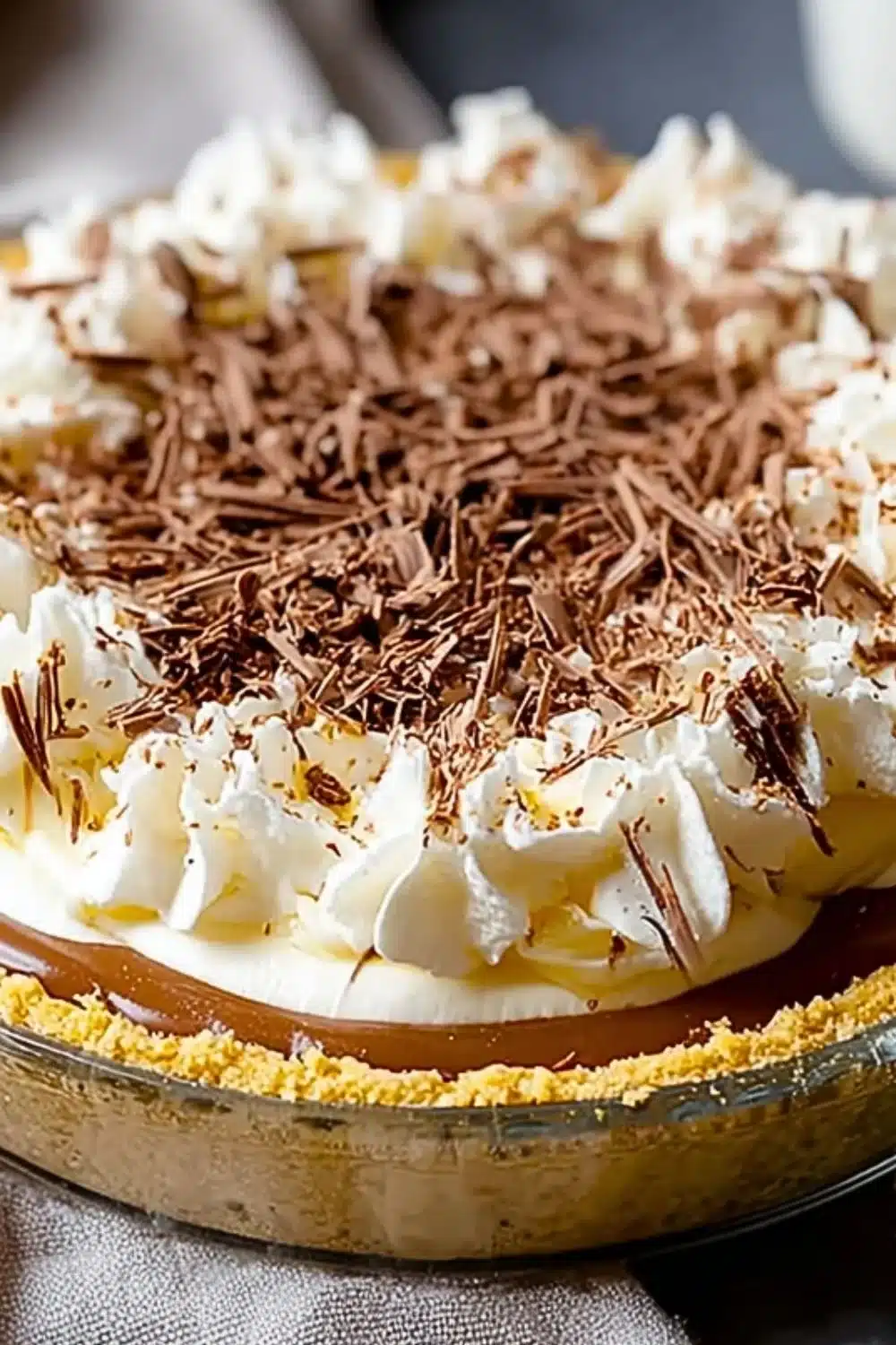 Delicious homemade Banoffee Pie with layers of banana, caramel, and whipped cream