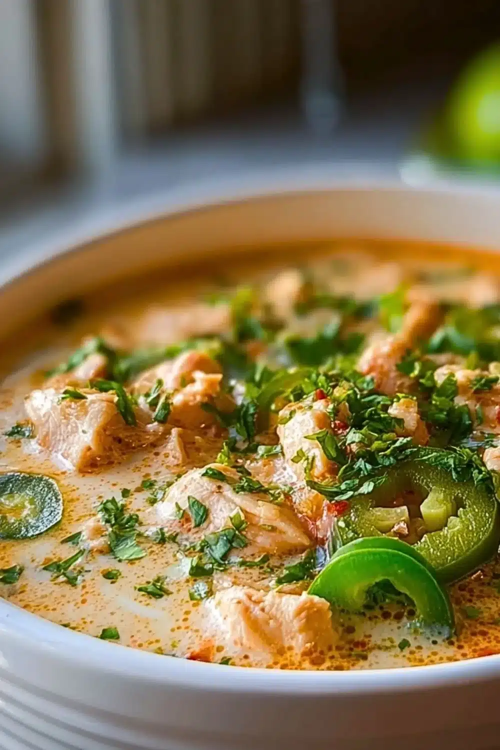 Bowl of spicy Cajun White Chicken Chili with toppings