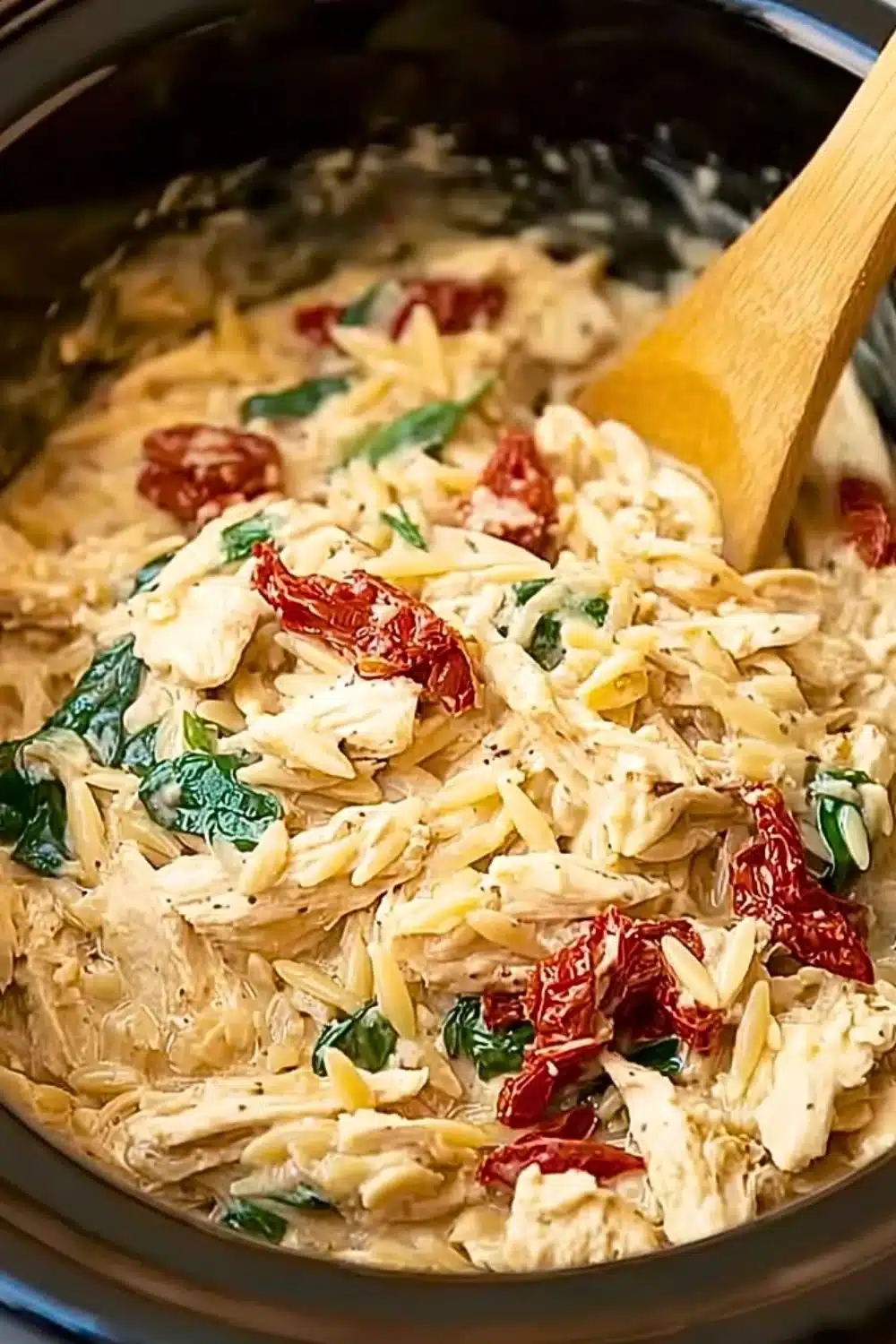 Delicious Crockpot Tuscan Chicken Orzo recipe with vibrant vegetables and spices