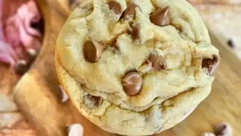 Delicious Crumbl chocolate chip cookie on a cooling rack
