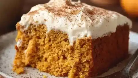 Flourless Pumpkin Spice Greek Yogurt Cake served on a plate with autumn decorations