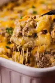 Delicious homemade Ground Beef Casserole with melted cheese and vegetables