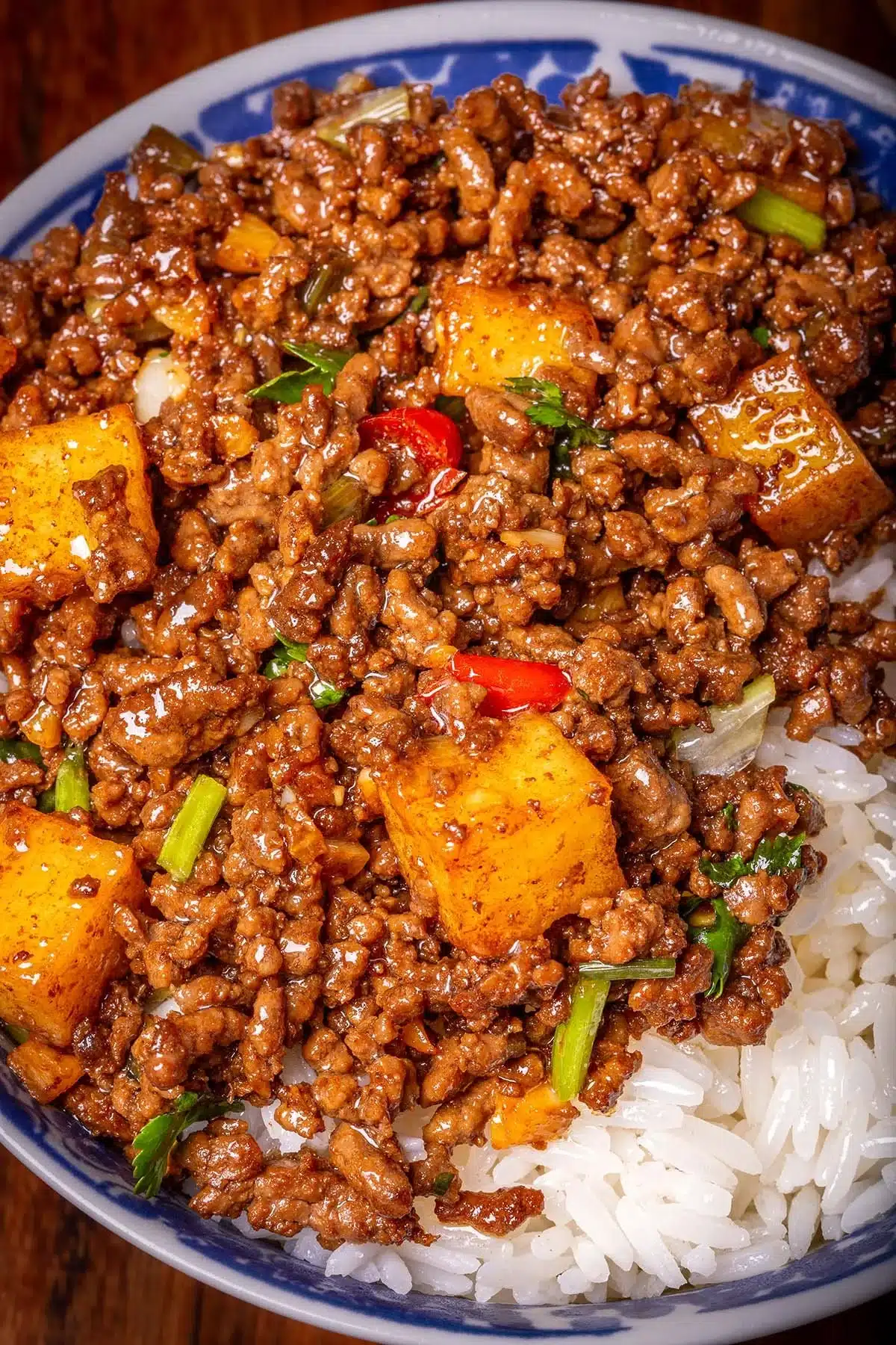 Ground beef stir fry with colorful vegetables in a frying pan