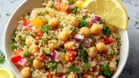 Bowl of lemon herb quinoa with chickpeas and fresh herbs