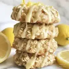 Lemon oatmeal no-bake cookies on a plate, topped with lemon zest.