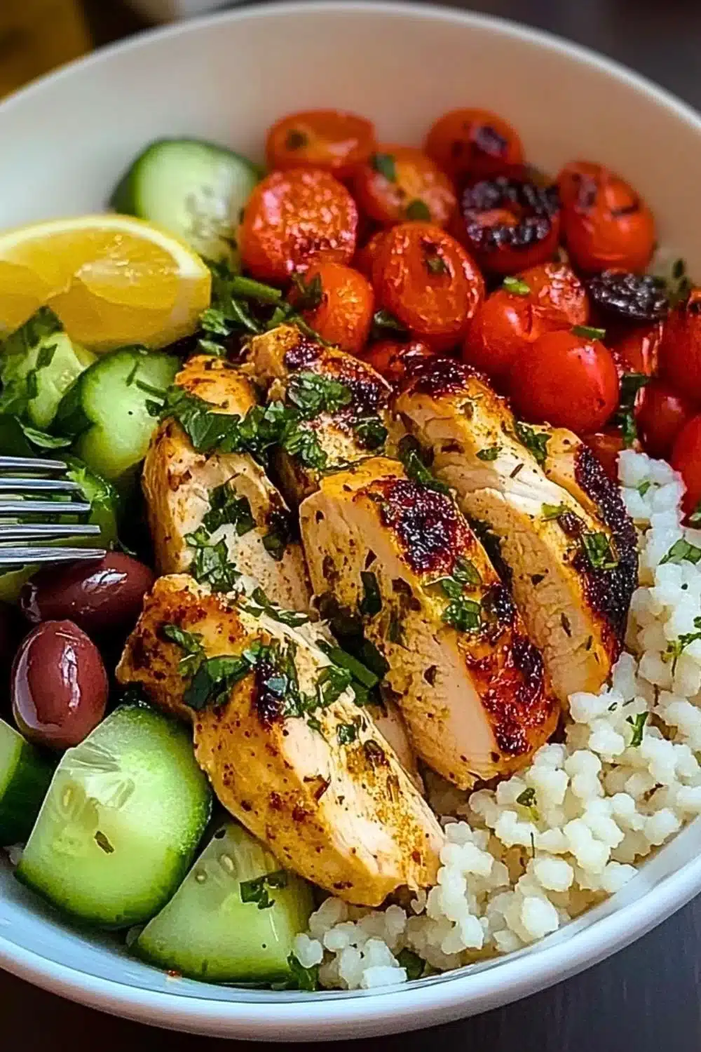 Delicious Mediterranean Chicken Bowl with fresh vegetables and herbs.