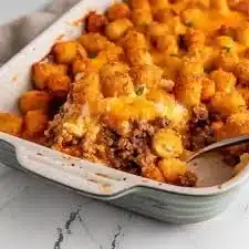 Tater Tot Casserole with Ground Beef topped with crispy tater tots