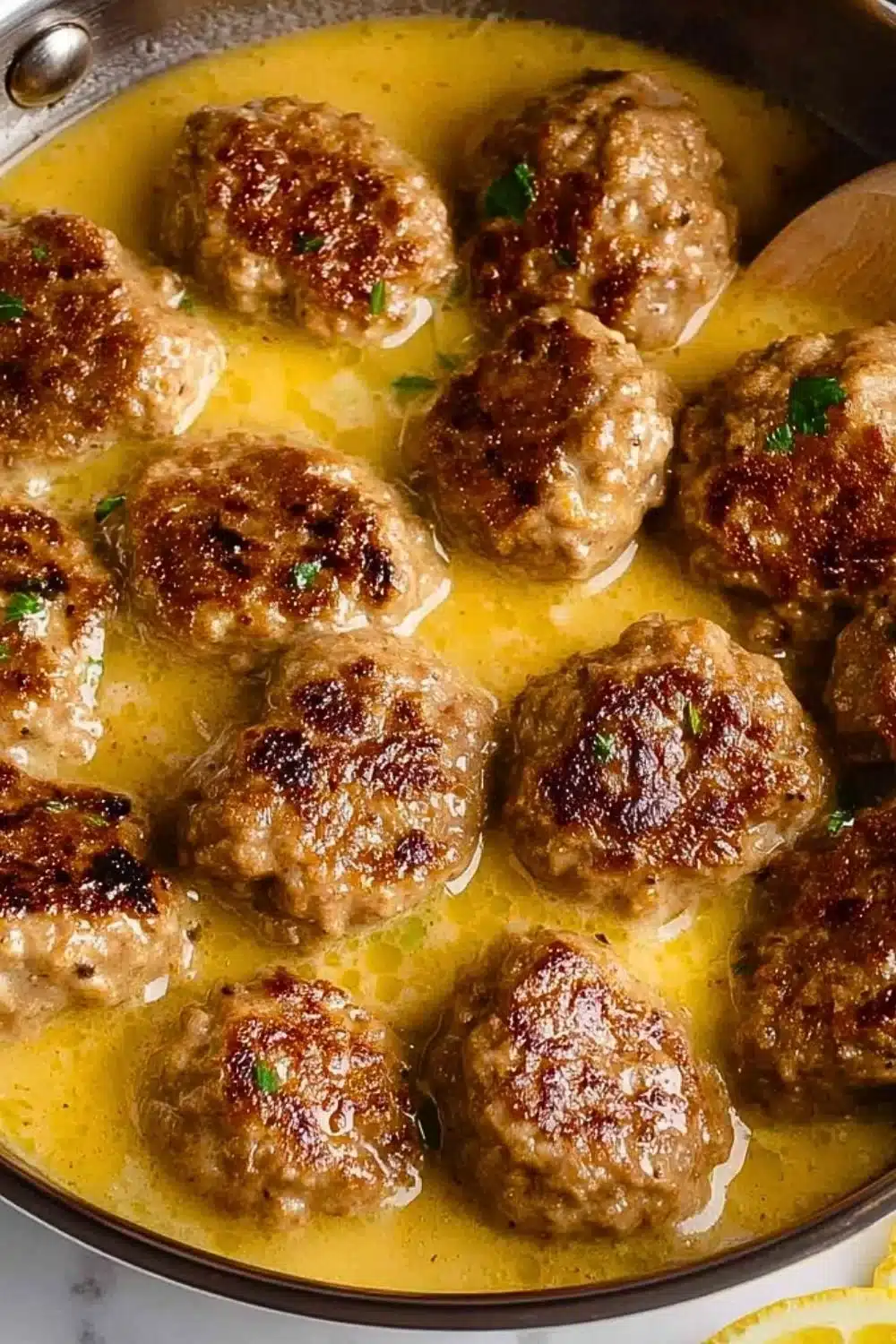 Delicious Greek meatballs in lemon sauce served on a plate