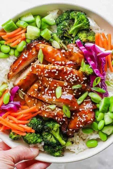 Delicious chicken rice bowl with fresh ingredients and vibrant colors