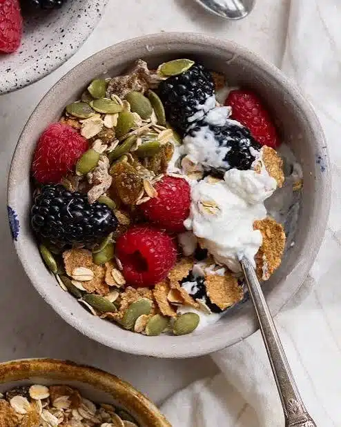 Healthy Greek yogurt breakfast served with fruits and nuts