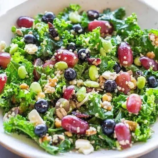 A vibrant bowl of healthy salad recipes featuring fresh vegetables and fruits.