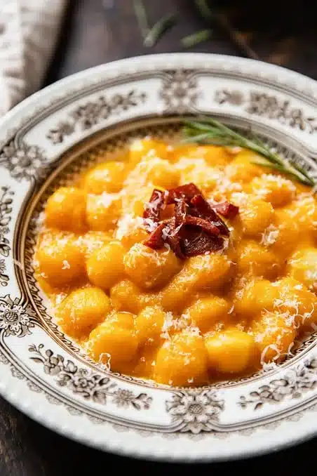 Creamy butternut squash gnocchi served with sausage