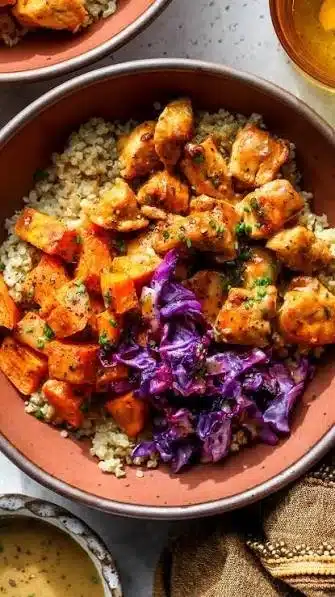 High protein chicken bowl with sweet potato, spinach, and quinoa for healthy eating