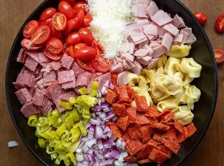 Italian Grinder Tortellini Salad with colorful vegetables and dressing