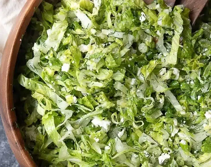 Fresh and vibrant lettuce salad with colorful vegetables and dressing