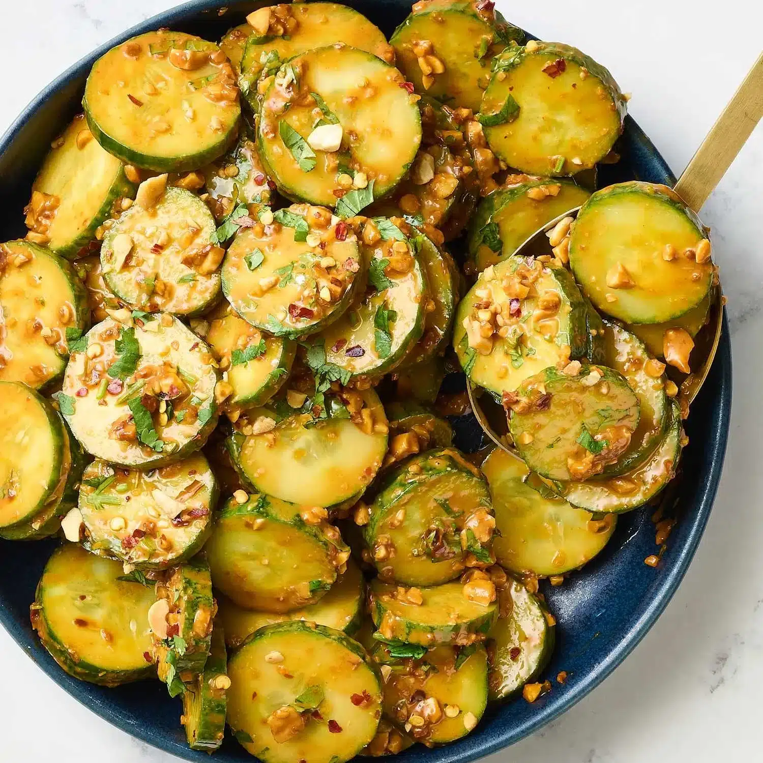 Spicy peanut cucumber dish featuring fresh cucumbers and spicy peanut sauce