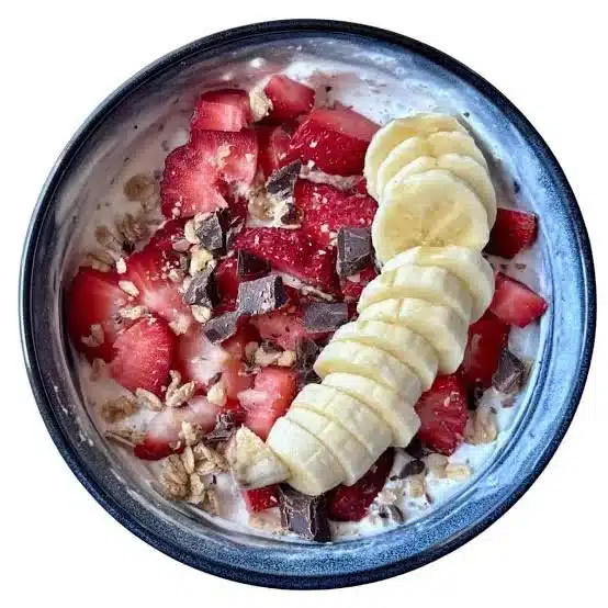 Strawberry Greek Yogurt Protein Bowl topped with fresh strawberries and granola